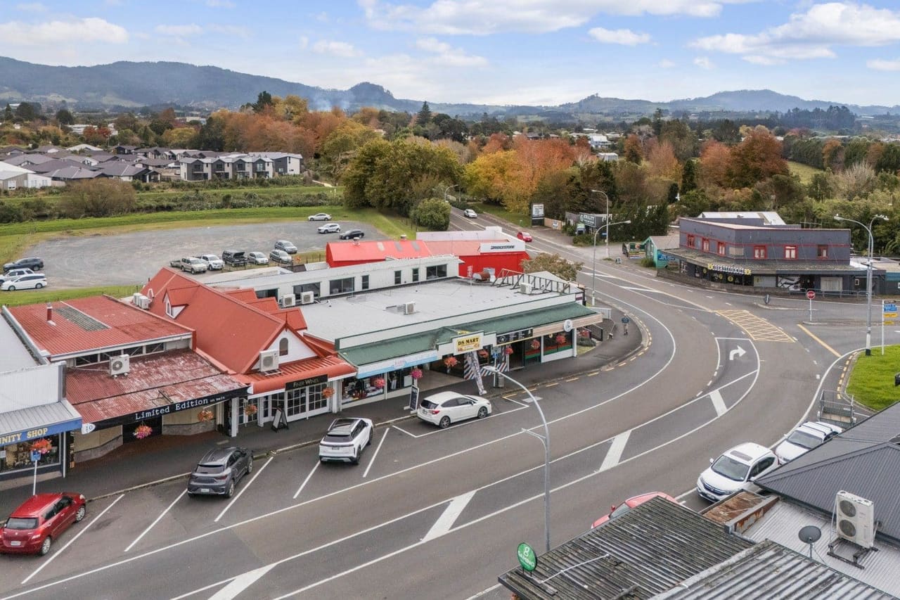 Aerial view of the Main Road shops in Katikati, with the Kaimai foothills behind
